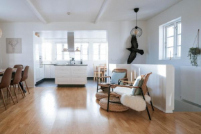 Ocean Views and Gorgeous Design in a Light-Filled 3 BDRM/1.5 Bath Village Home